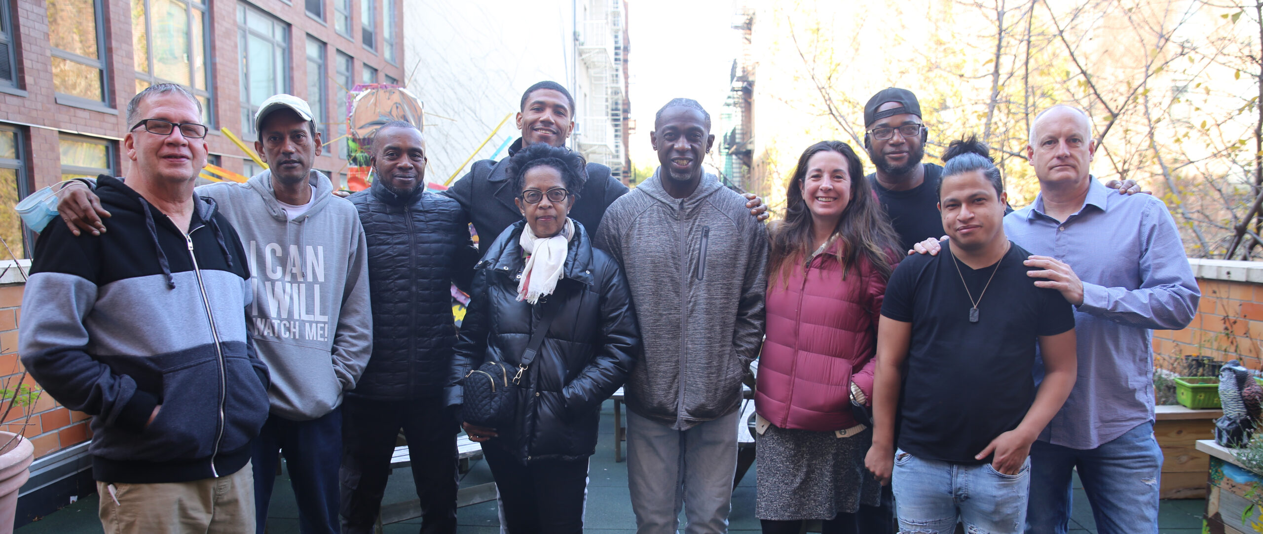 group of people standing together outside.