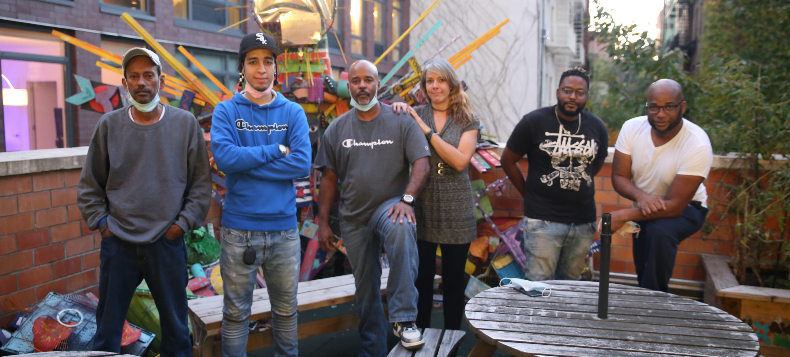 group of people standing together outside.