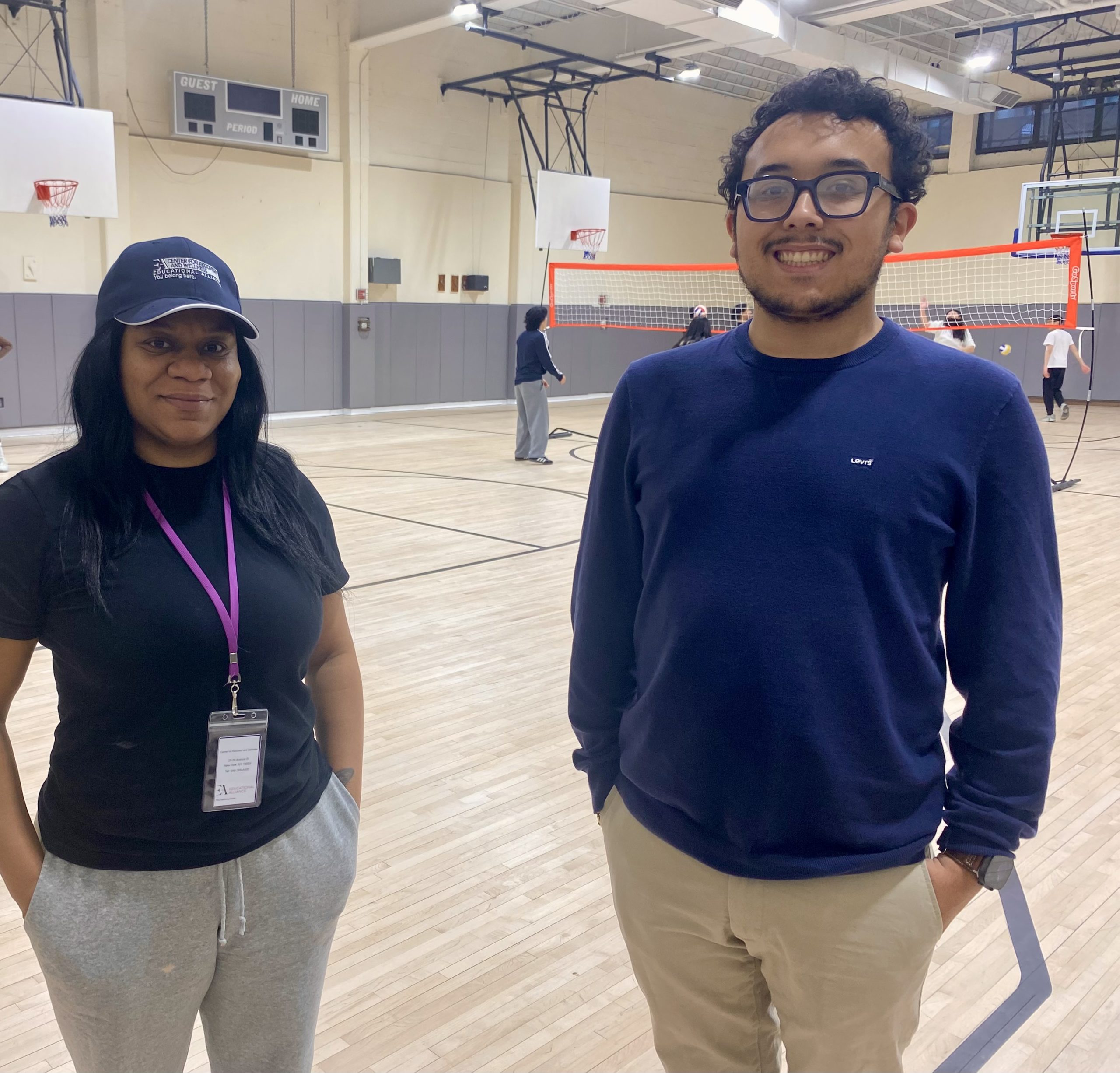 three people sitting together inside